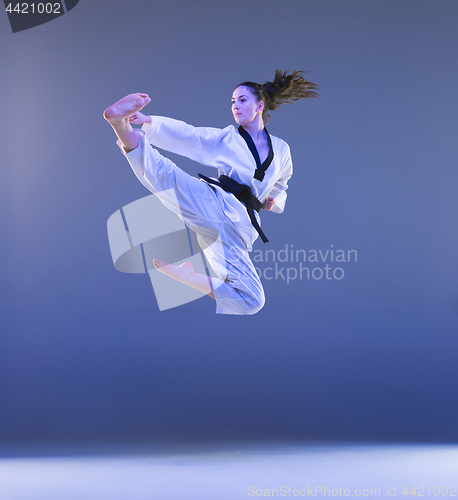 Image of The karate girl with black belt