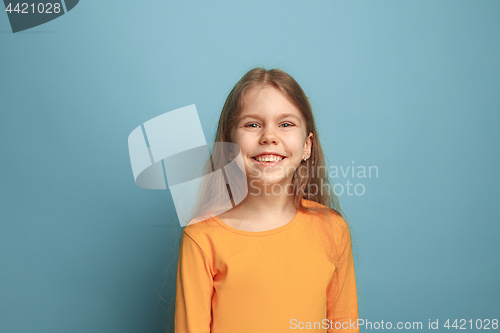 Image of Win - emotional blonde teen girl have a happiness look and toothy smiling. Studio shot