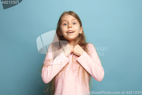 Image of Win - emotional blonde teen girl have a happiness look and toothy smiling. Studio shot