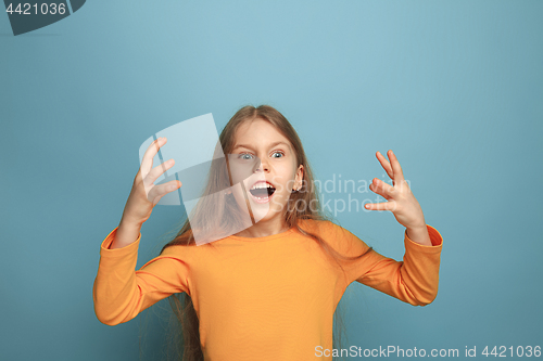 Image of Win - emotional blonde teen girl have a happiness look and toothy smiling. Studio shot