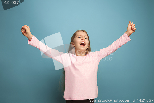Image of Win - emotional blonde teen girl have a happiness look and toothy smiling. Studio shot