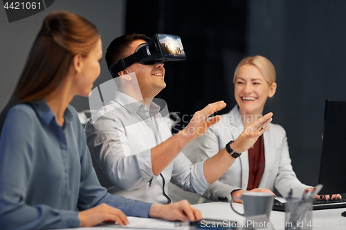 Image of developers with virtual reality headset at office