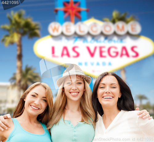 Image of group of happy women or friends at las vegas