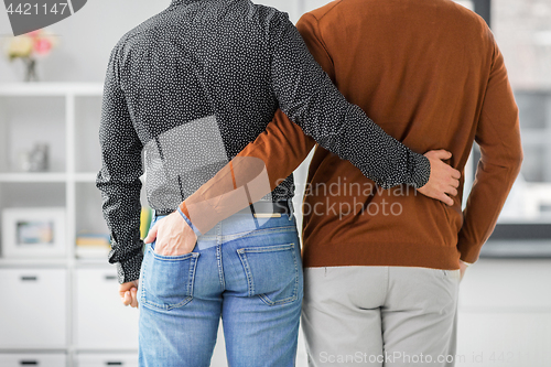 Image of close up of hugging male gay couple