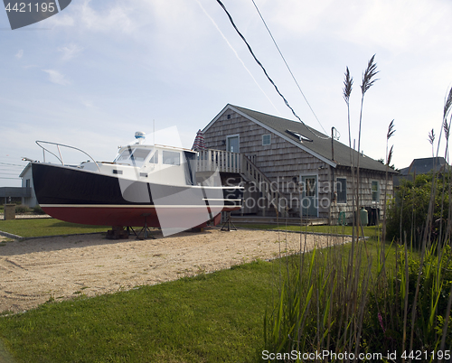 Image of beach house with boat Ditch Plains Montauk New York