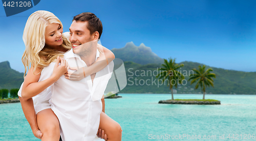 Image of happy couple over bora bora background