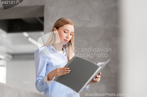 Image of female office worker with folder