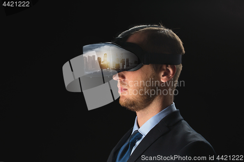 Image of businessman in virtual reality glasses or headset