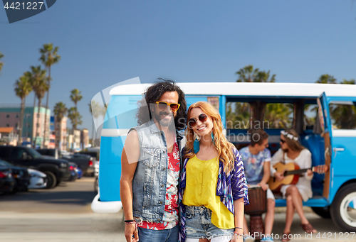 Image of hippie couple over minivan at venice beach in la