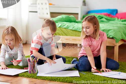 Image of happy creative kids drawing at home