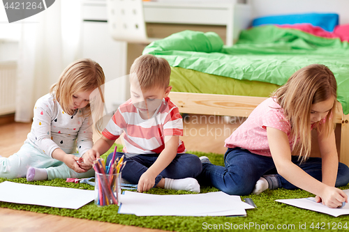 Image of happy creative kids drawing at home