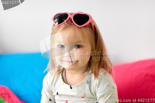 Image of portrait of smiling little girl with sunglasses