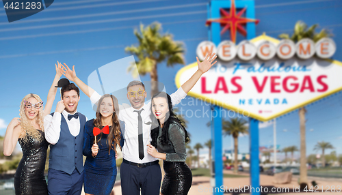 Image of happy friends with party props posing at las vegas