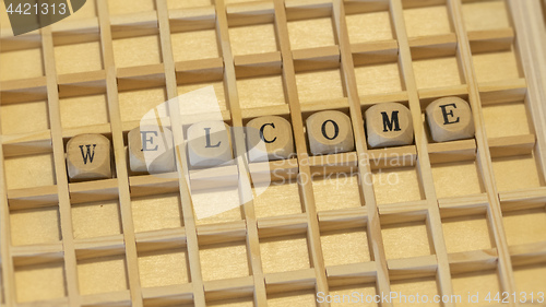 Image of wooden dice welcome