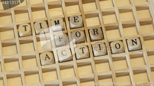 Image of wooden dice time for action