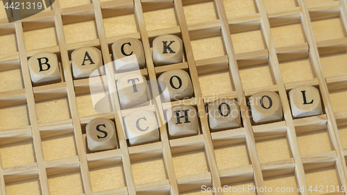 Image of wooden dice text back to school