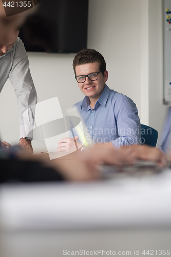 Image of Group of young people meeting in startup office