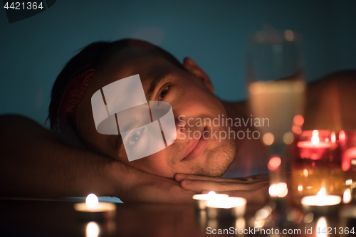 Image of man relaxing in the jacuzzi