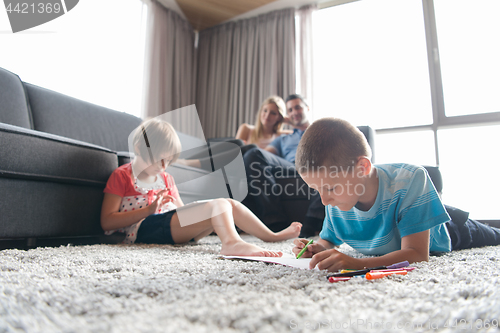 Image of young couple spending time with kids