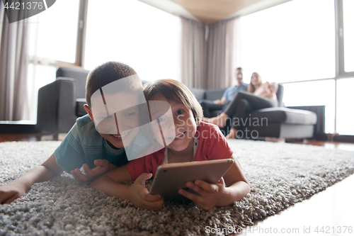 Image of couple spending time with kids