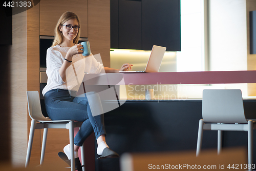 Image of woman drinking coffee enjoying relaxing lifestyle