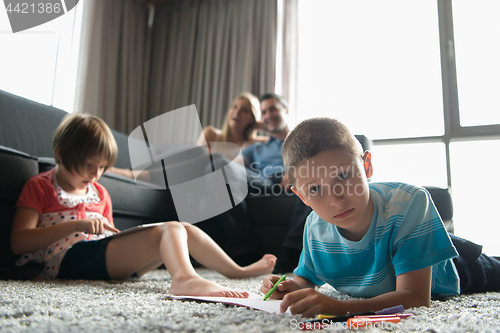 Image of young couple spending time with kids