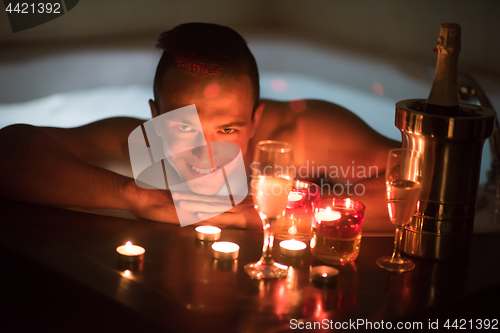 Image of man relaxing in the jacuzzi