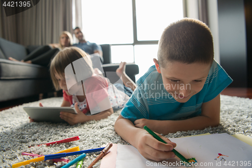 Image of young couple spending time with kids