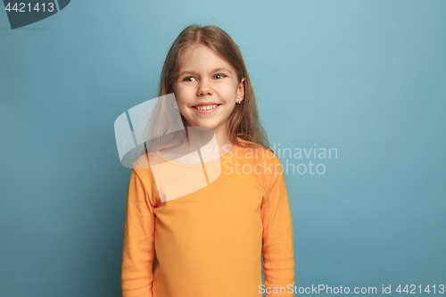 Image of The emotional blonde teen girl have a happiness look and toothy smiling. Studio shot