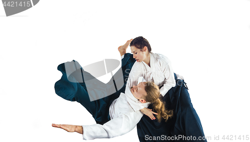 Image of Man and woman fighting at Aikido training in martial arts school