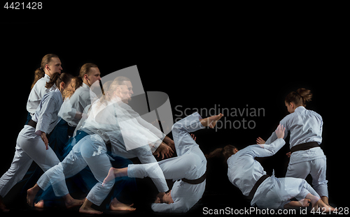 Image of Man and woman fighting at Aikido training in martial arts school