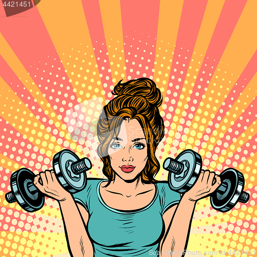 Image of Beautiful woman with dumbbells in gym