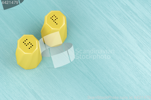 Image of Yellow salt and pepper shakers