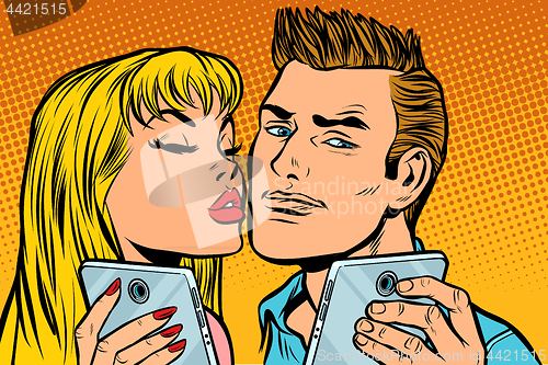 Image of young couple kiss selfie on smartphone