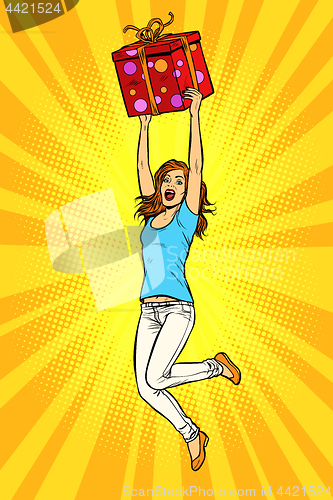 Image of Joyful young woman jumping up with a gift