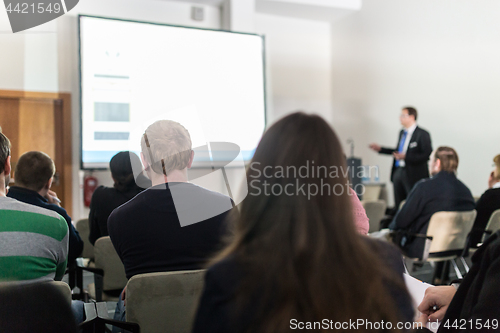 Image of Business speaker giving a talk at business conference event.