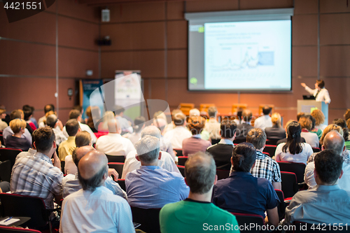 Image of Business speaker giving a talk at business conference event.