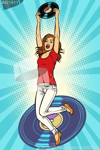 Image of Music and vinyl. Joyful young woman jumping up