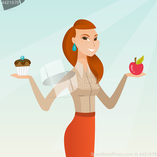 Image of Woman choosing between apple and cupcake.