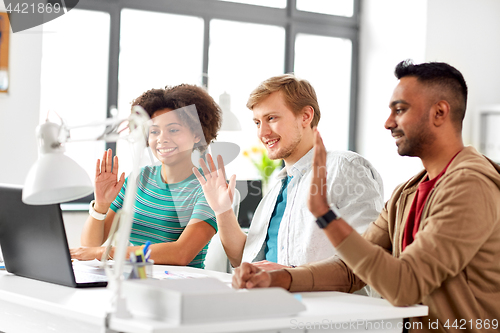 Image of creative team having video conference at office