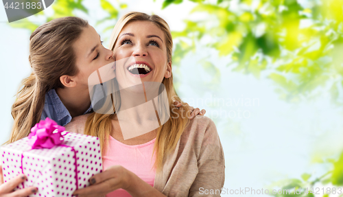 Image of daughter kissing mother and giving her present