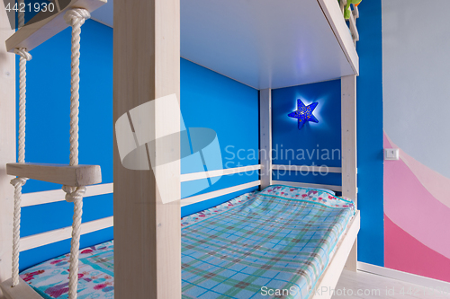 Image of Lower berth and rope ladder to the top of the children\'s bunk bed