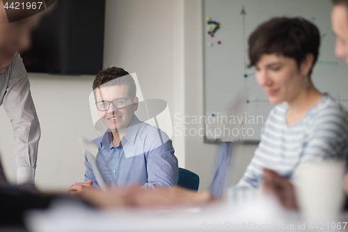 Image of Group of young people meeting in startup office