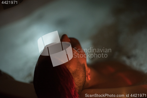 Image of man relaxing in the jacuzzi