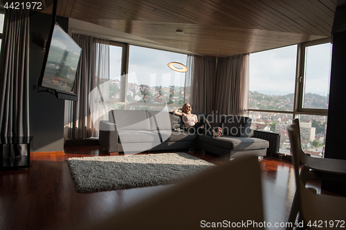 Image of woman using tablet in beautiful apartment