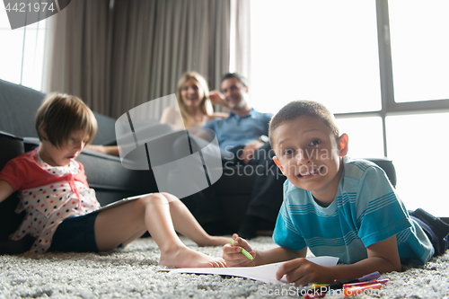 Image of young couple spending time with kids