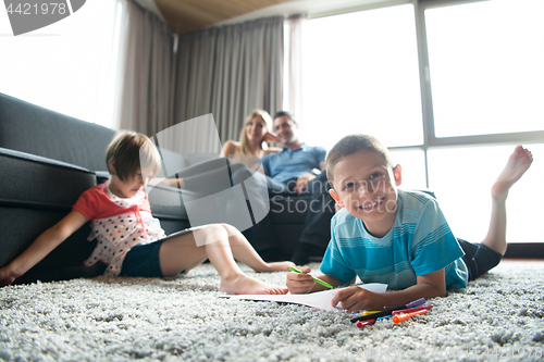 Image of young couple spending time with kids