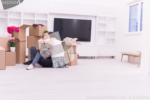 Image of young couple moving  in new house