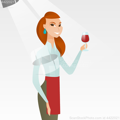 Image of Waitress holding a glass of wine in hand.