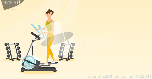 Image of Woman exercising on elliptical trainer.
